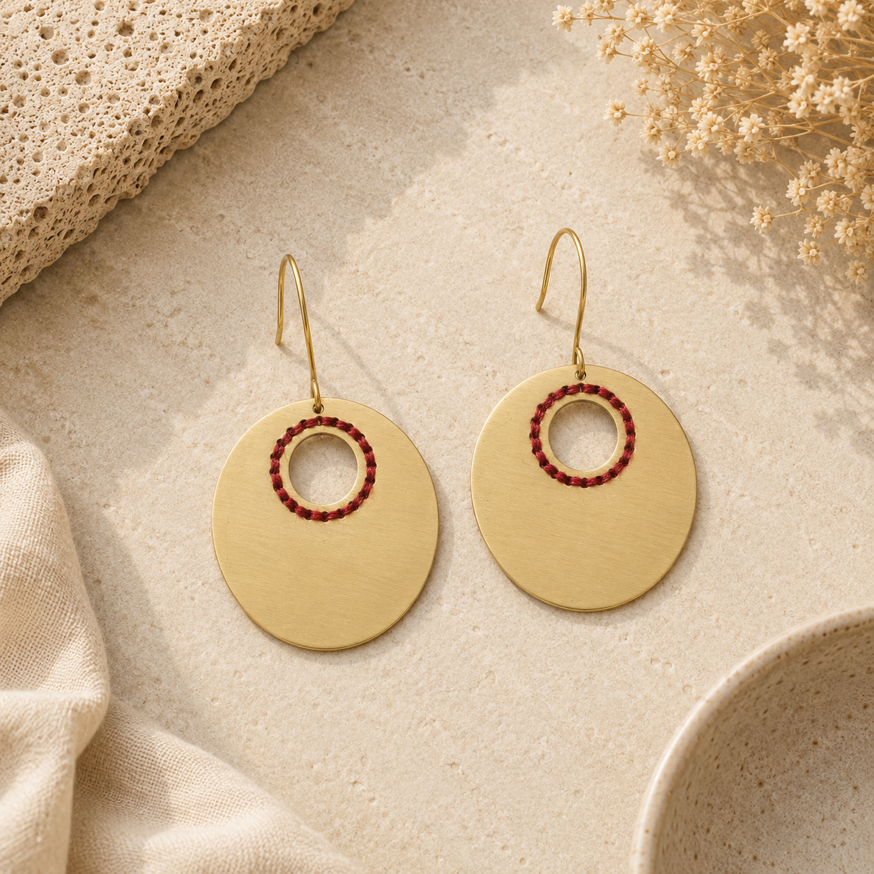 ANUVA Brass Oval Earrings with Red Thread Ring Artisan Detail