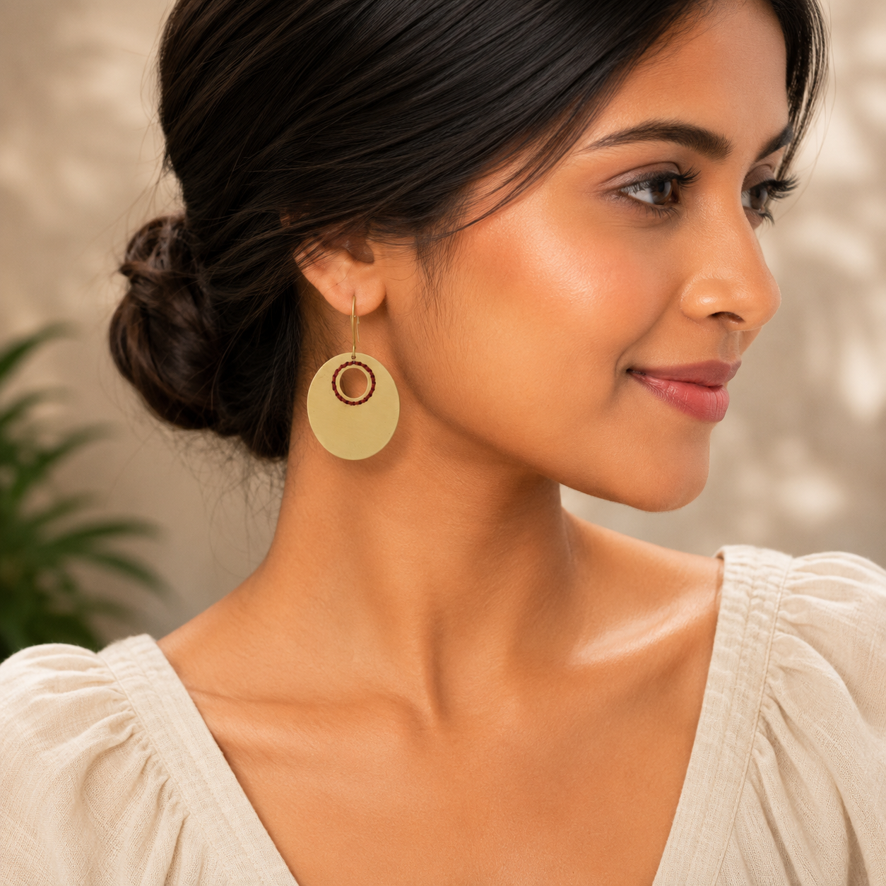 ANUVA Brass Oval Earrings with Red Thread Ring Artisan Detail